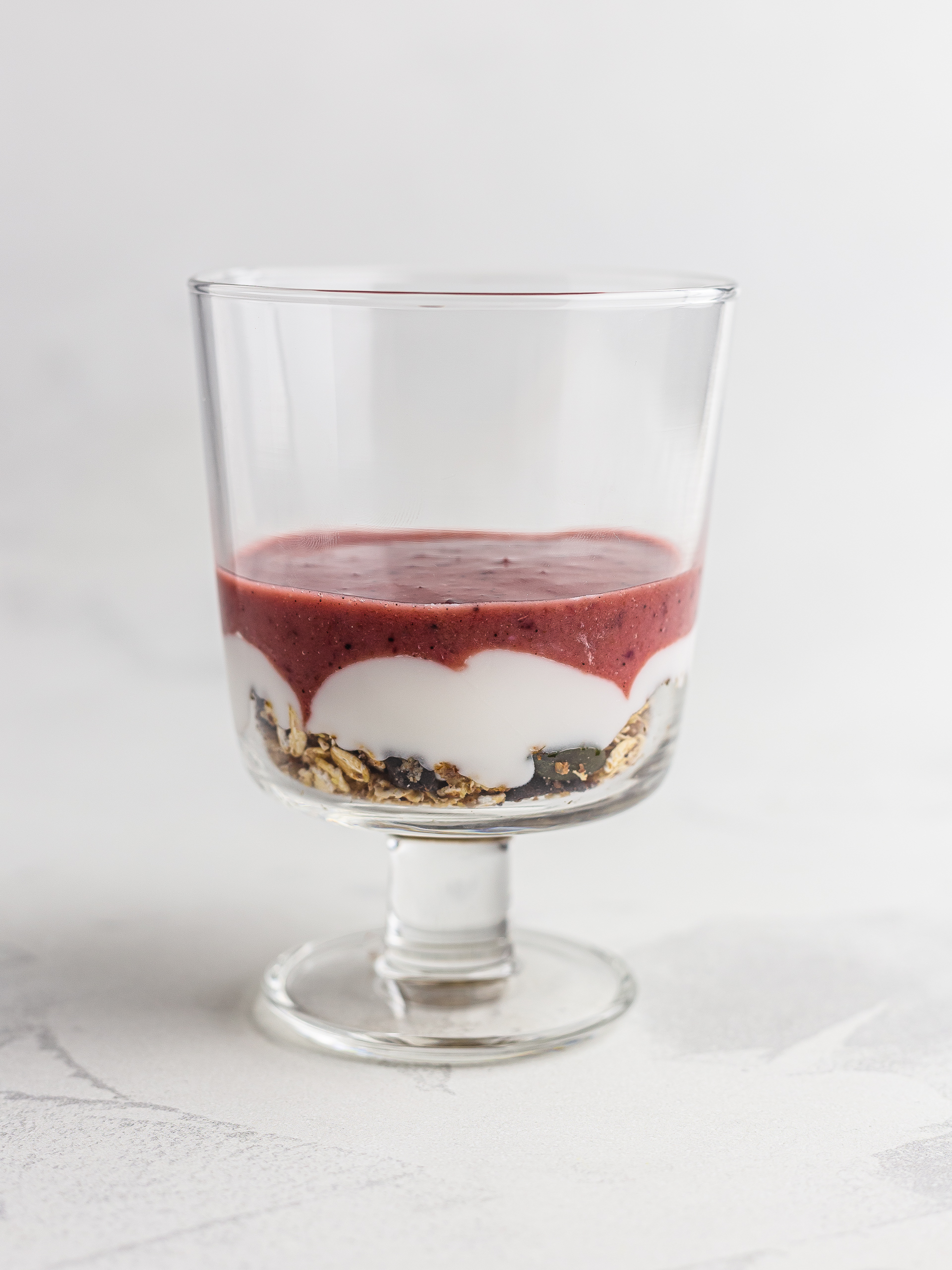 cherry parfait with yogurt layers in a glass