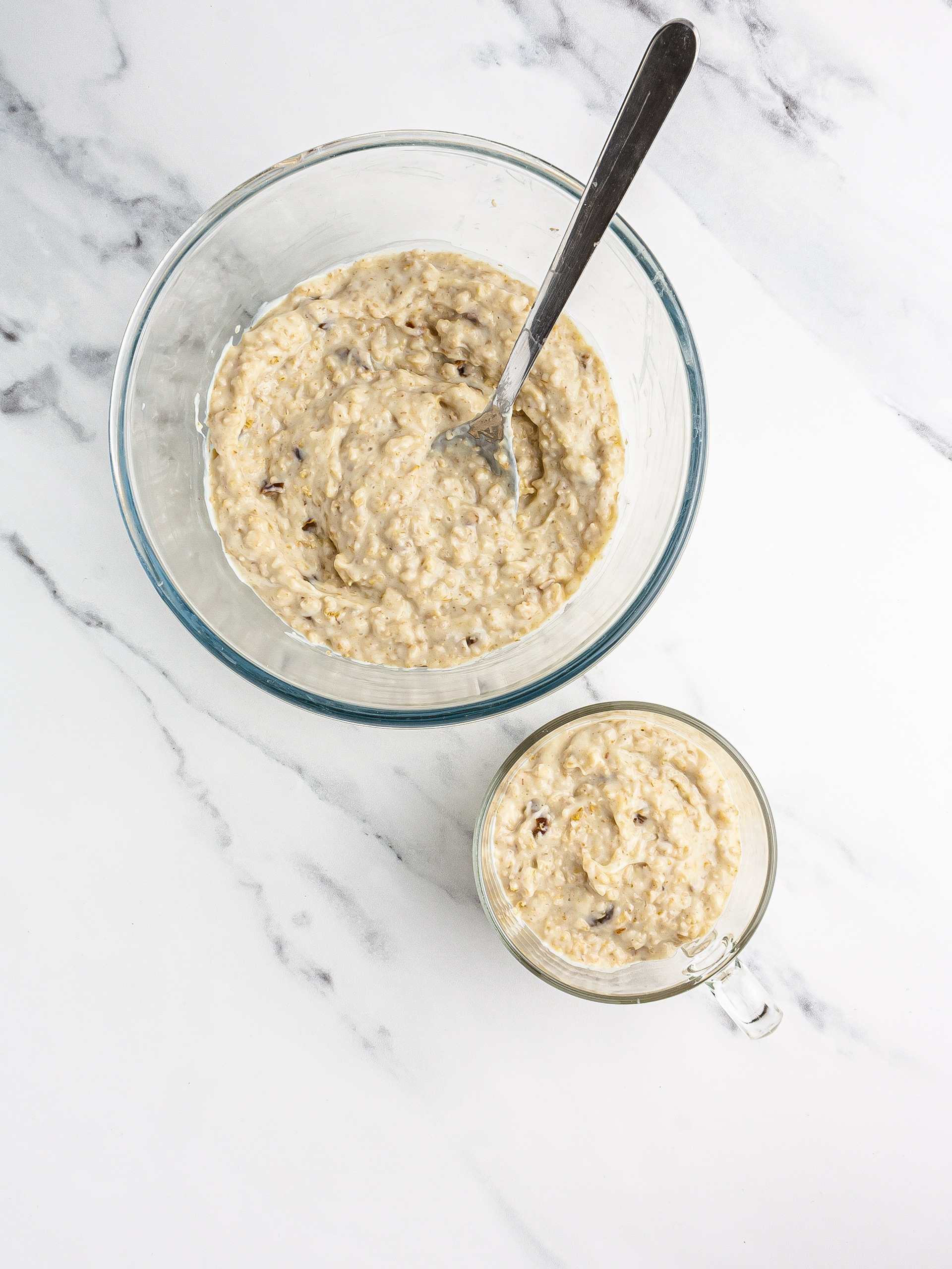 Yogurt oatmeal spooned in a serving glass.