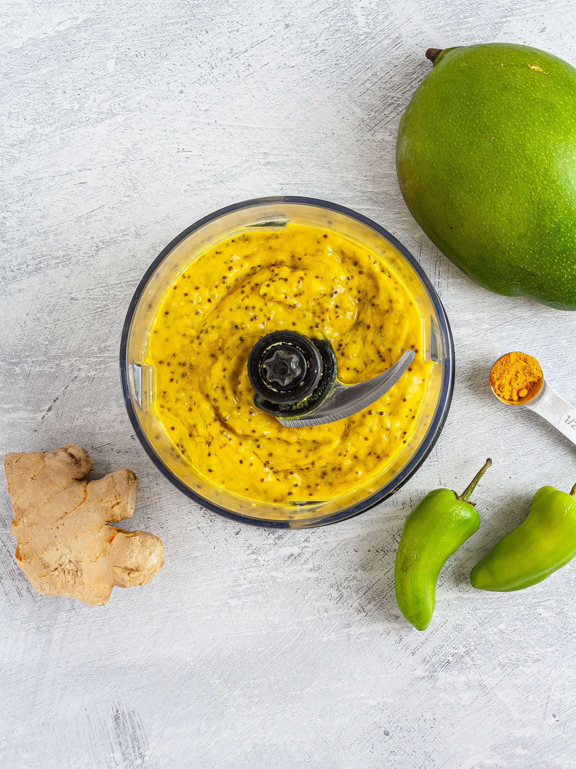 Mustard sauce with mango, chillies, turmeric, and ginger.