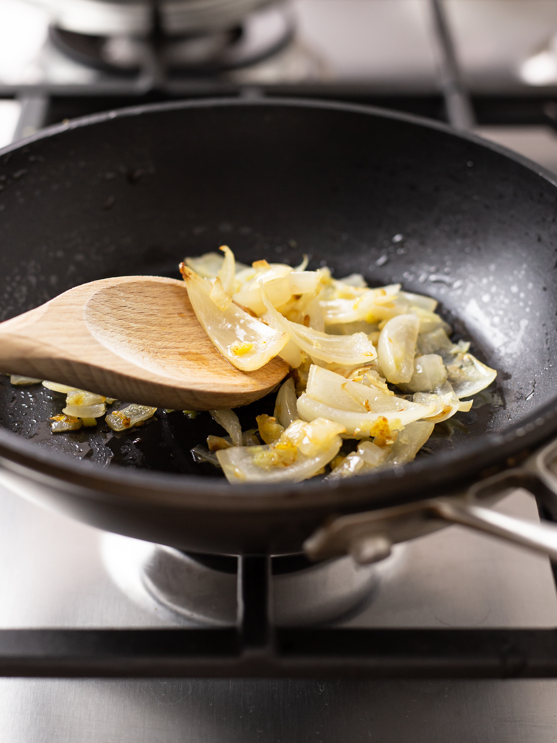 onion sizzled with garlic and ginger in a pan