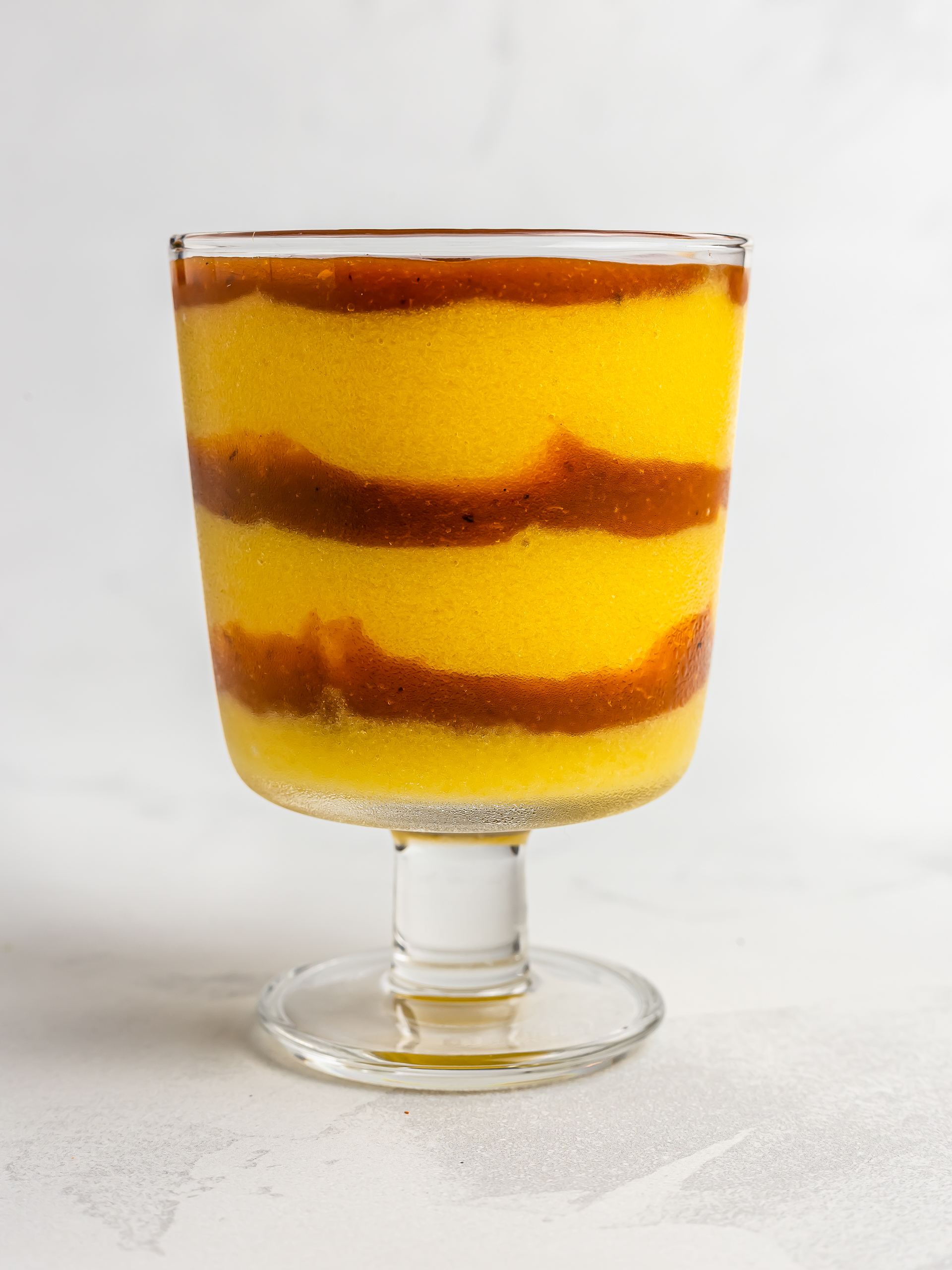 layered mango sorbet and chamoy sauce for mangonada