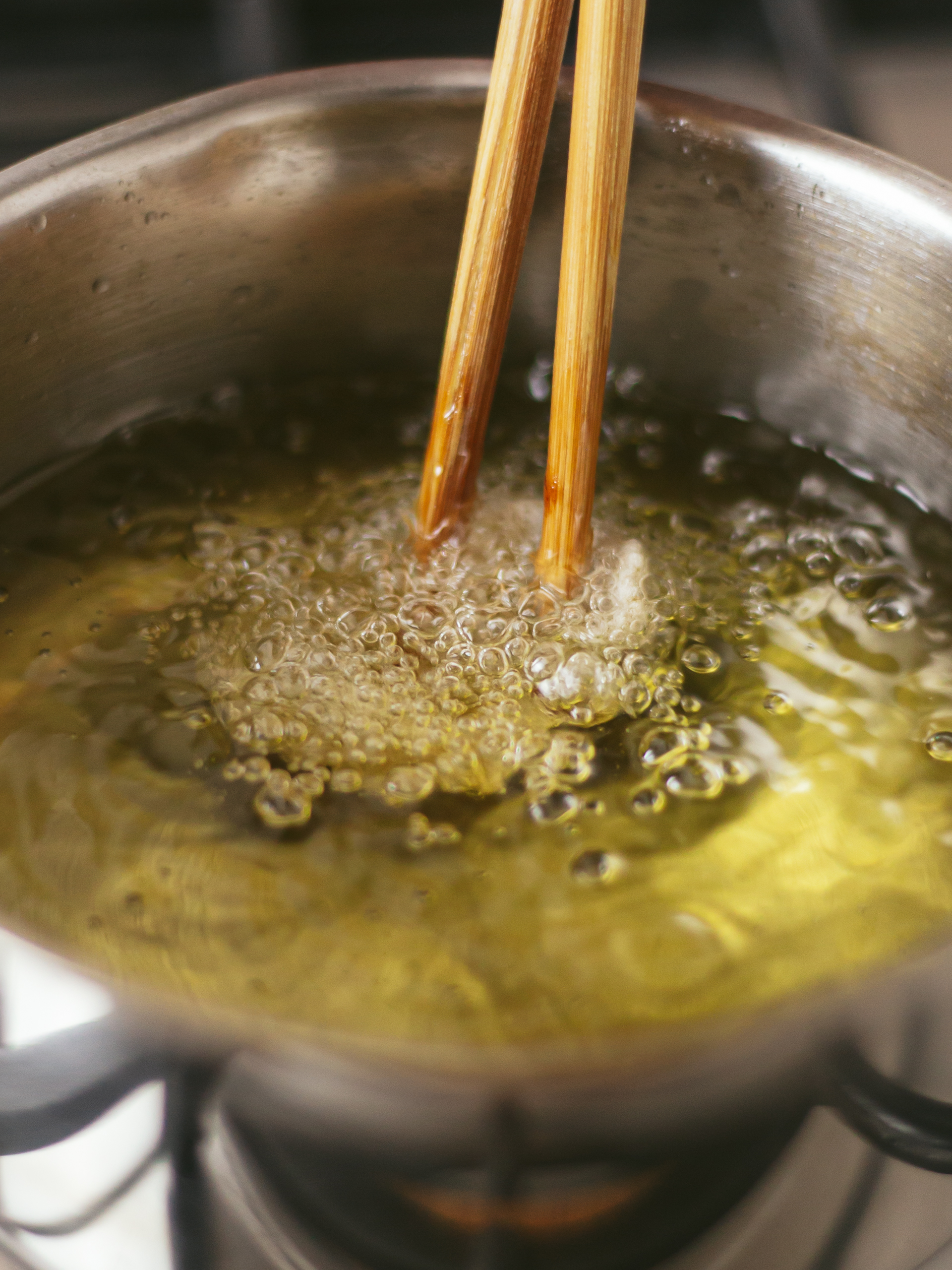 vegan prawn cracker chips fried in a pot of oil