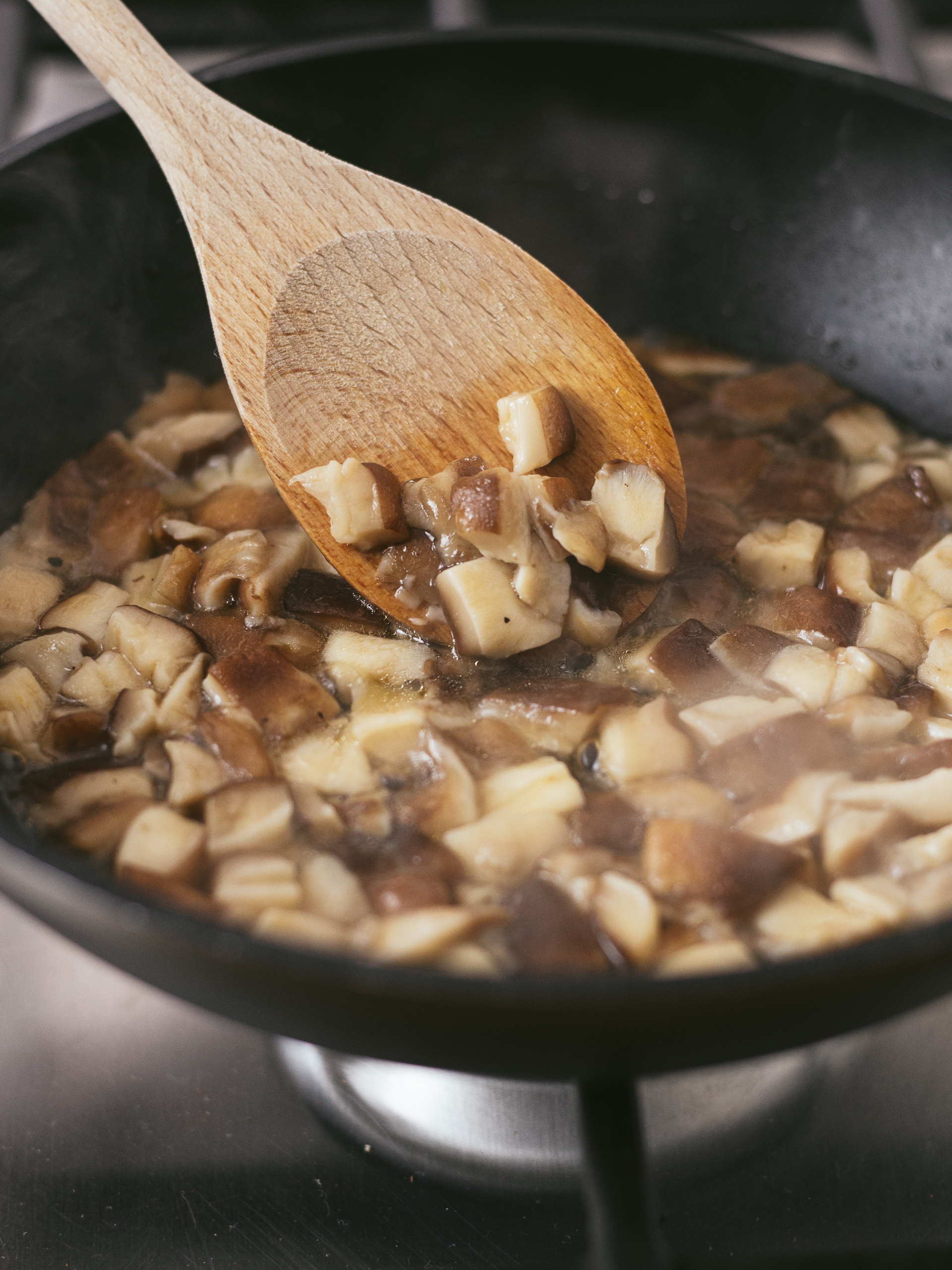 shiitake mushrooms cooking in a pan