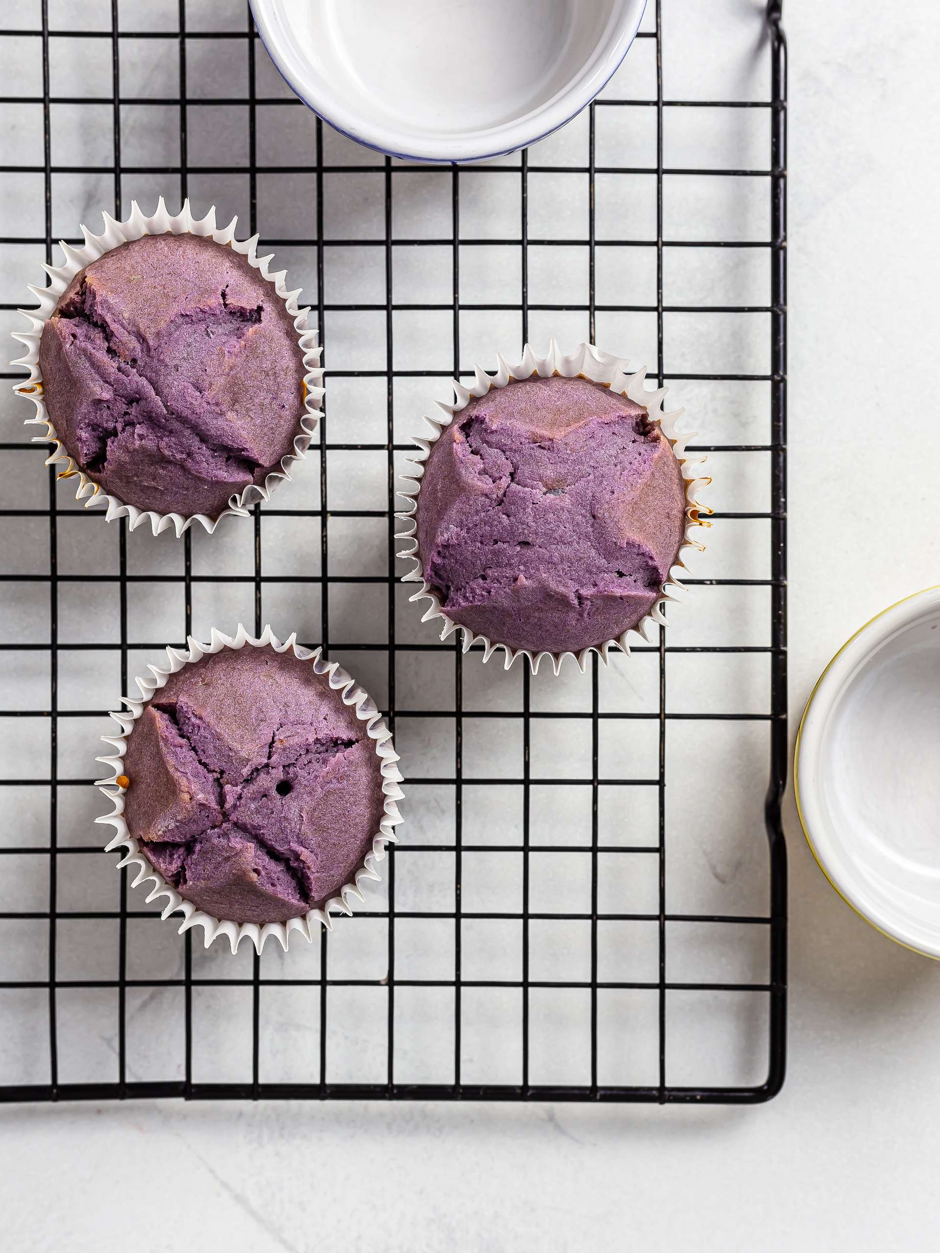 baked ube cupcakes on a rack
