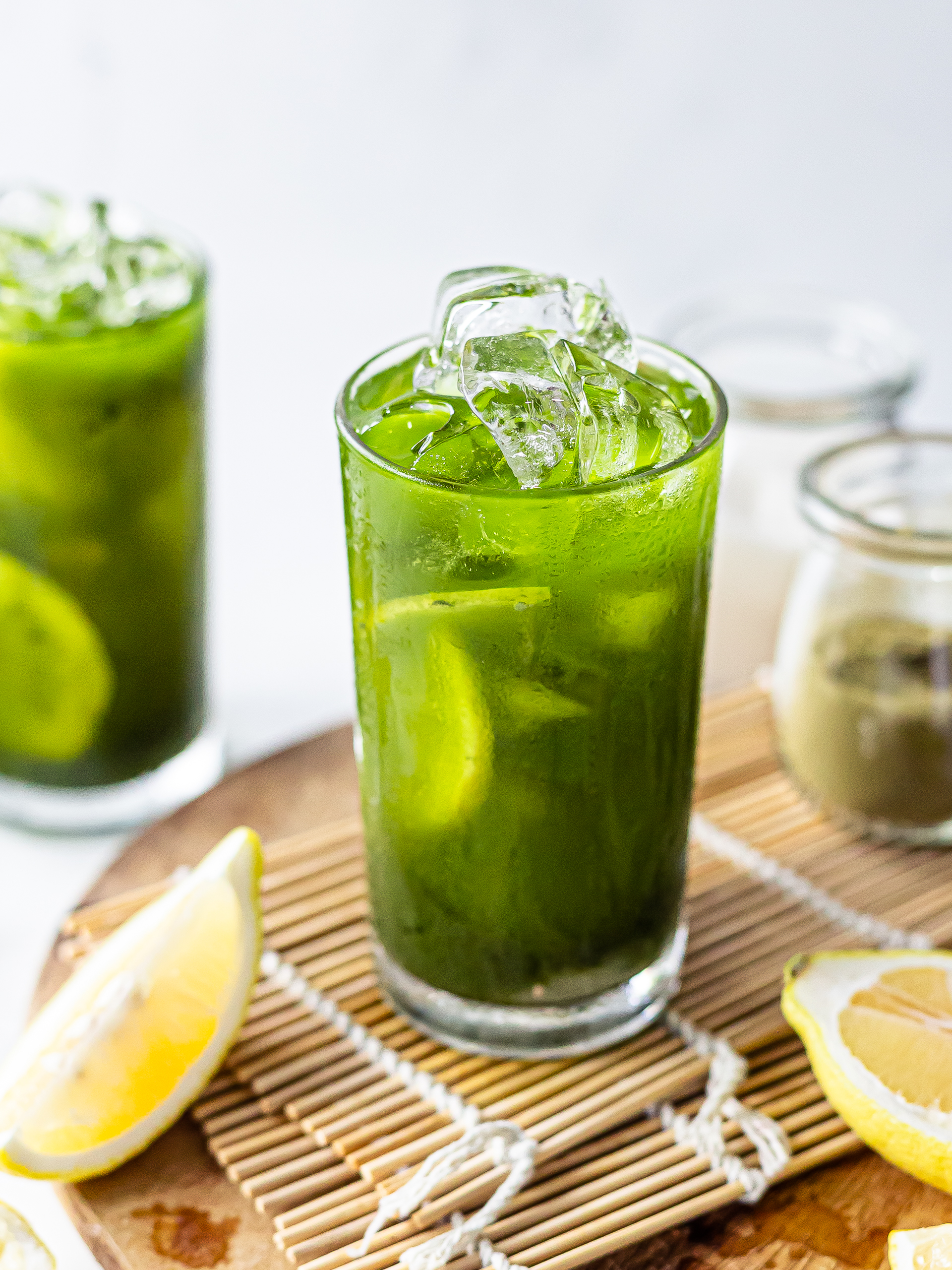 green tea matcha lemonade in a glass with ice