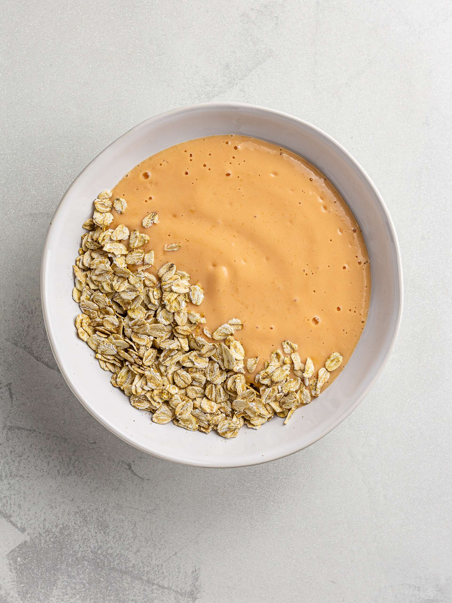 papaya smoothie with oats in a bowl