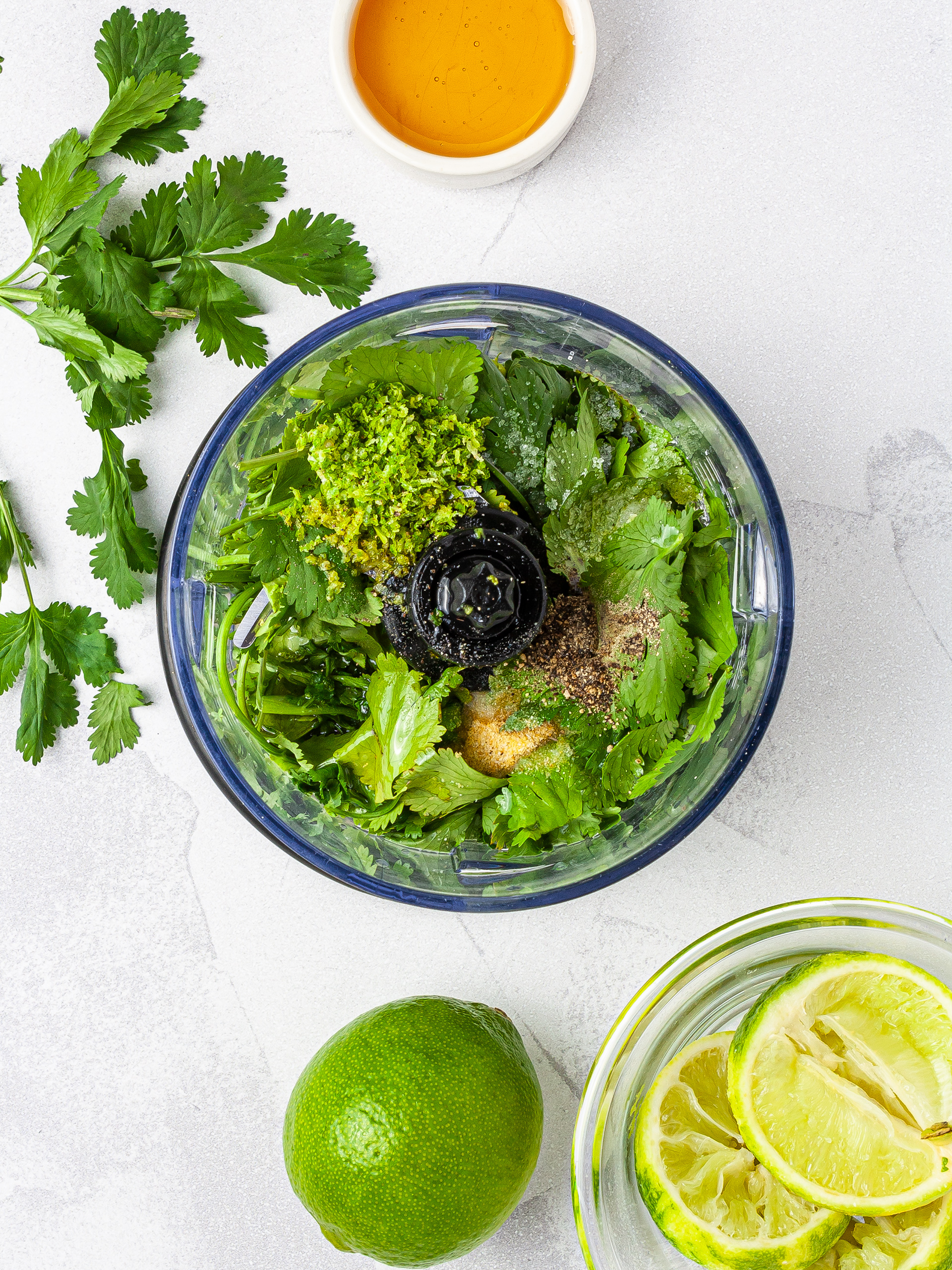 Cilantro, lime, and honey in a food processor to prepare the dressing.