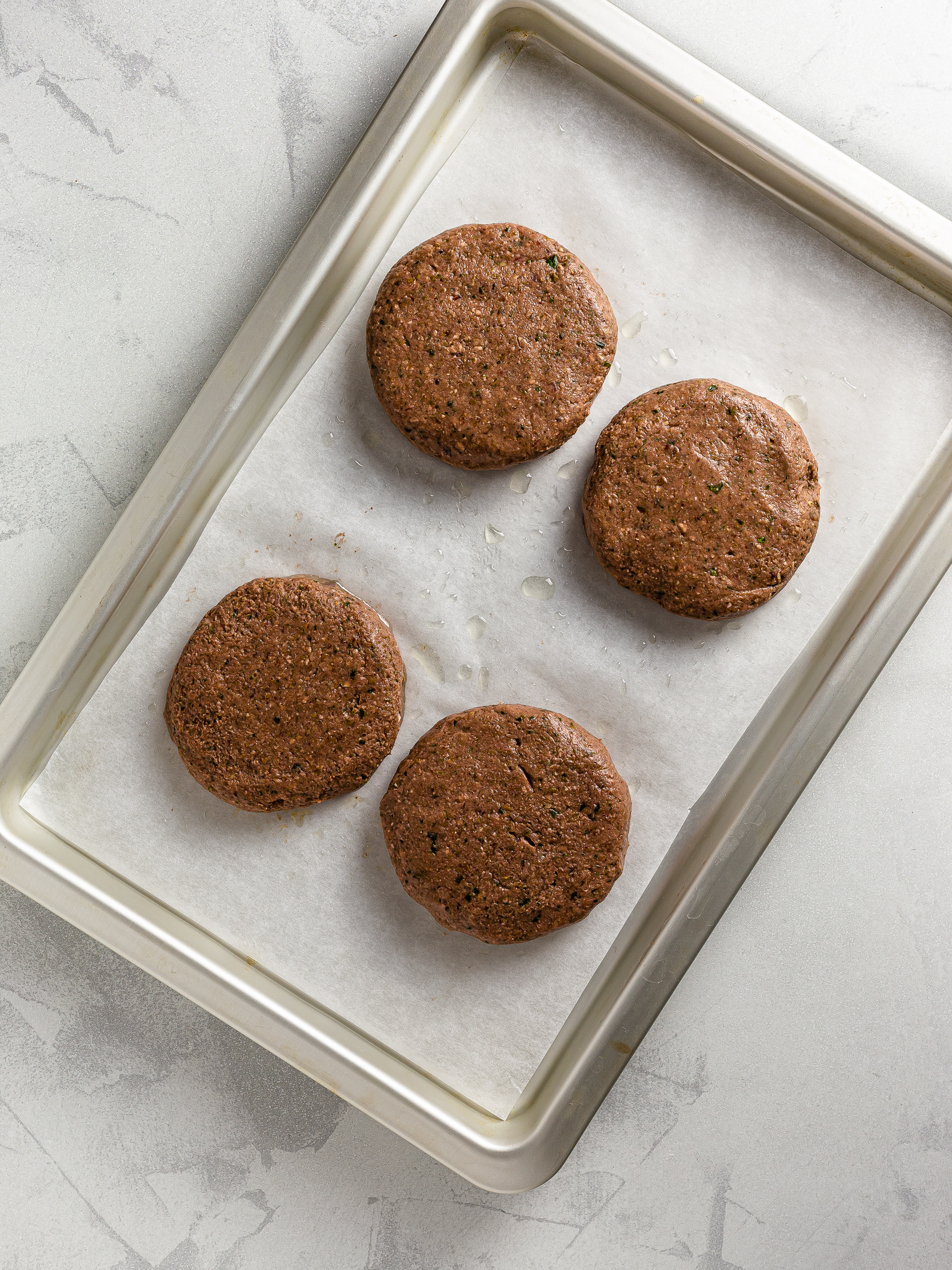 mung bean burger patties on a baking tray