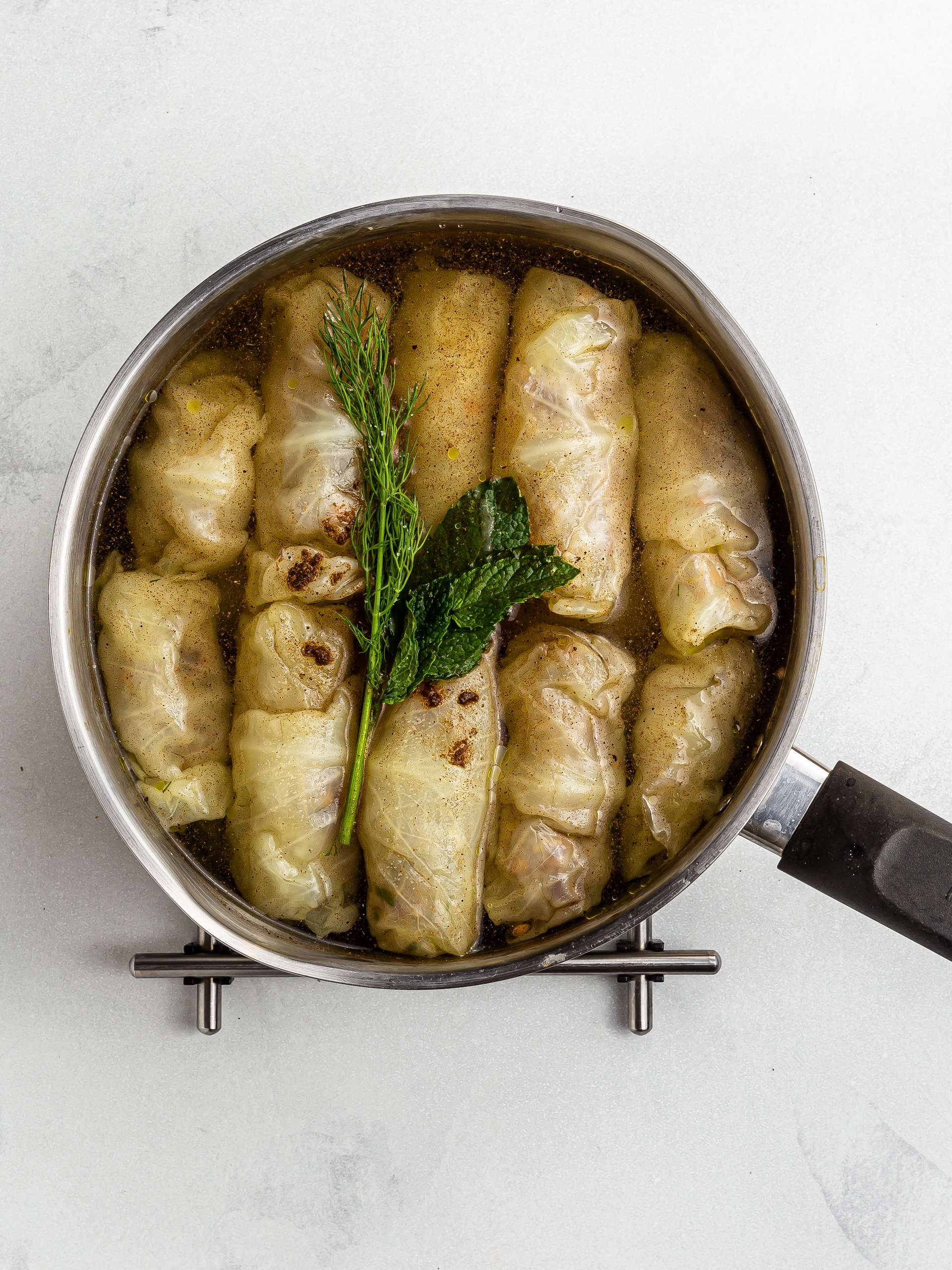 cabbage rolls cooking in a pot