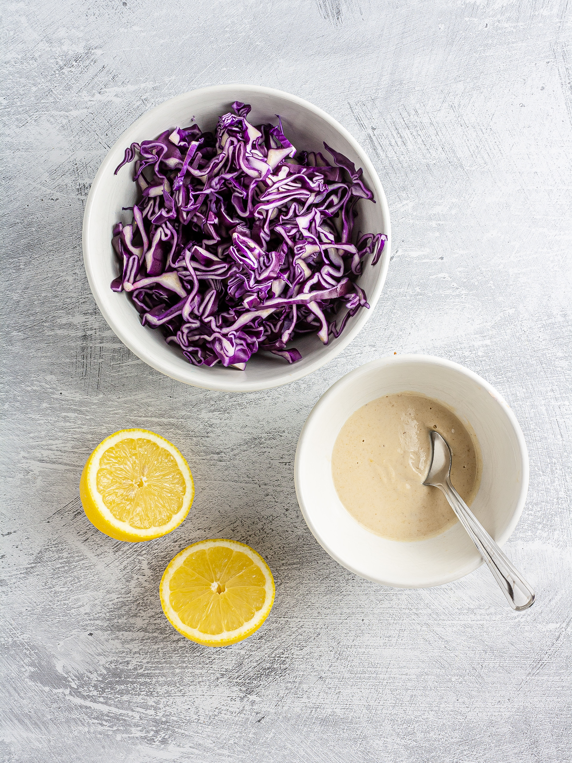 Shredded red cabbage and lemon tahini dressing