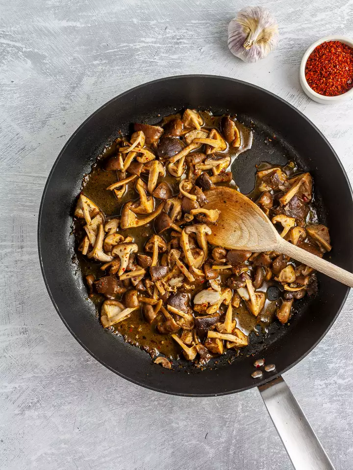 Cooked Shiitake mushrooms with garlic, oregano, and chillies