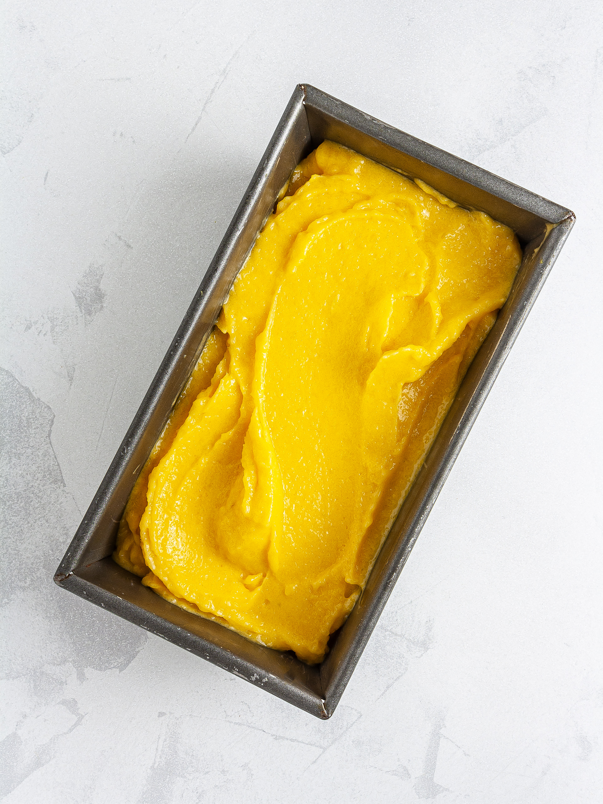 Mango sorbet in a tin