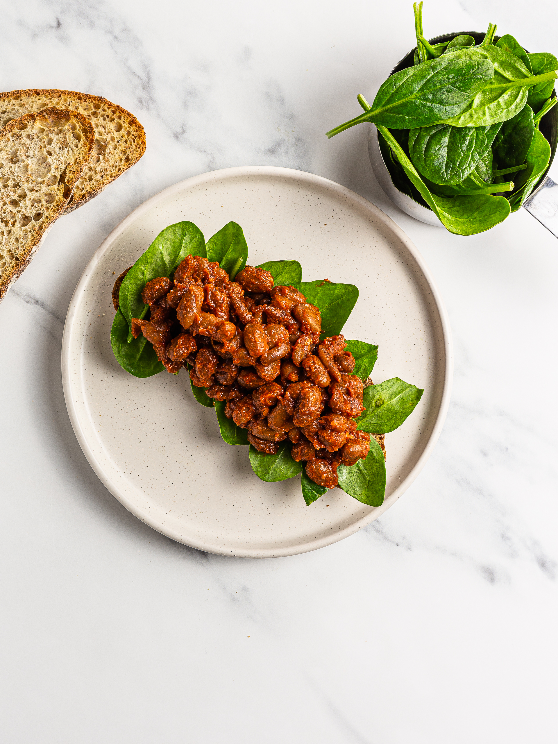 maple baked beans with spinach and sourdough bread toast
