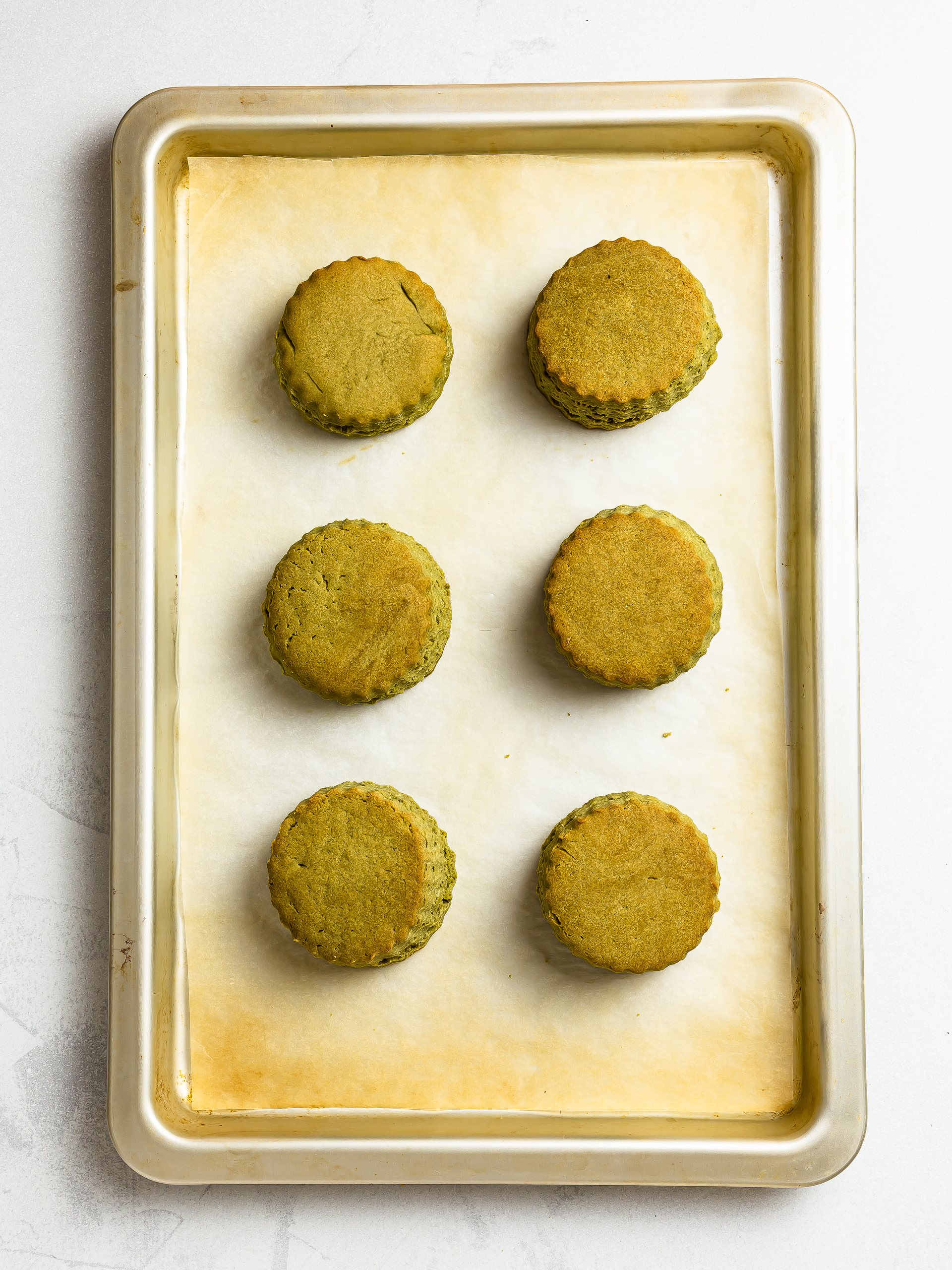 baked matcha scones on a tray