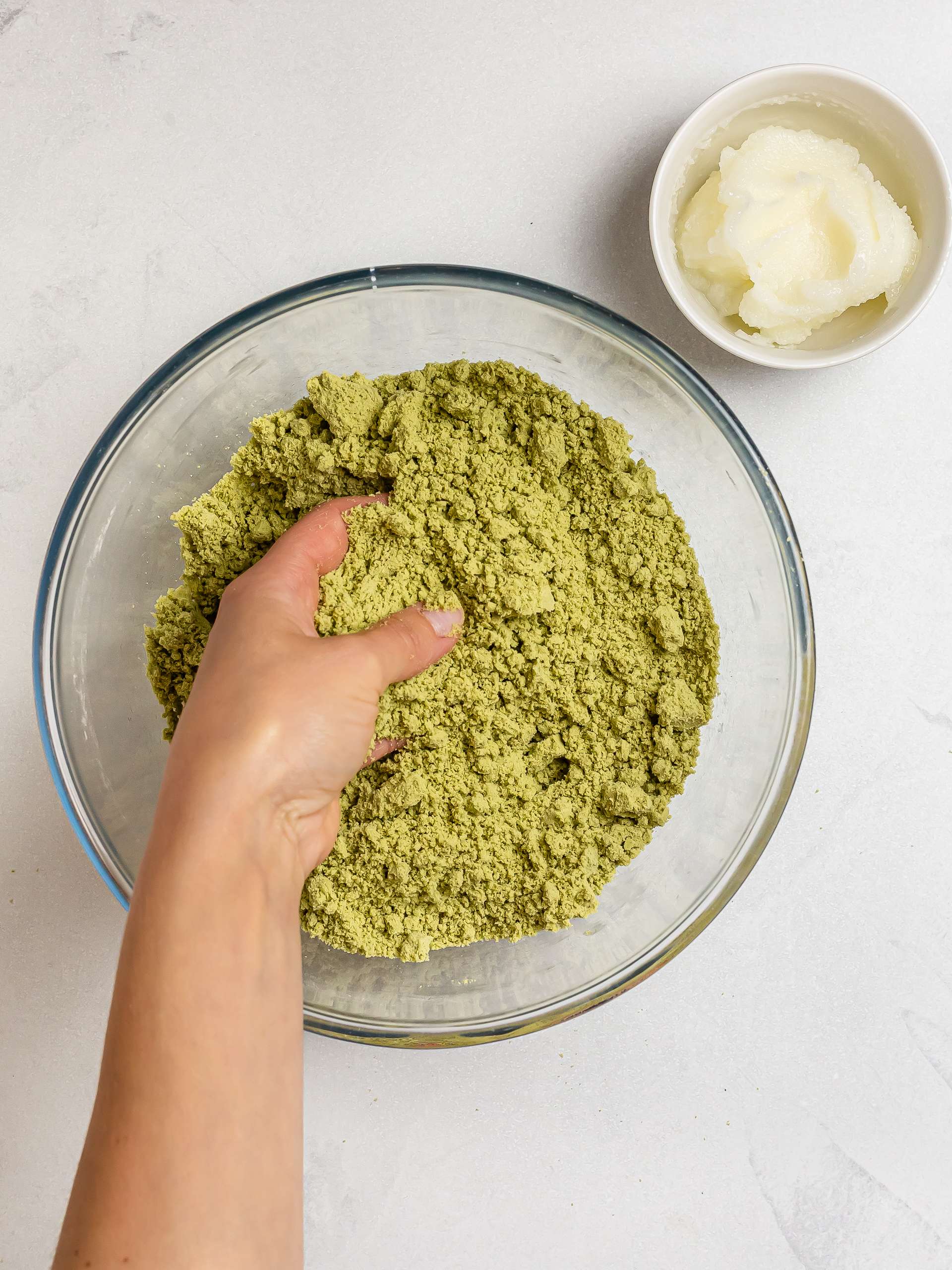 rubbing matcha scone dough with fingers