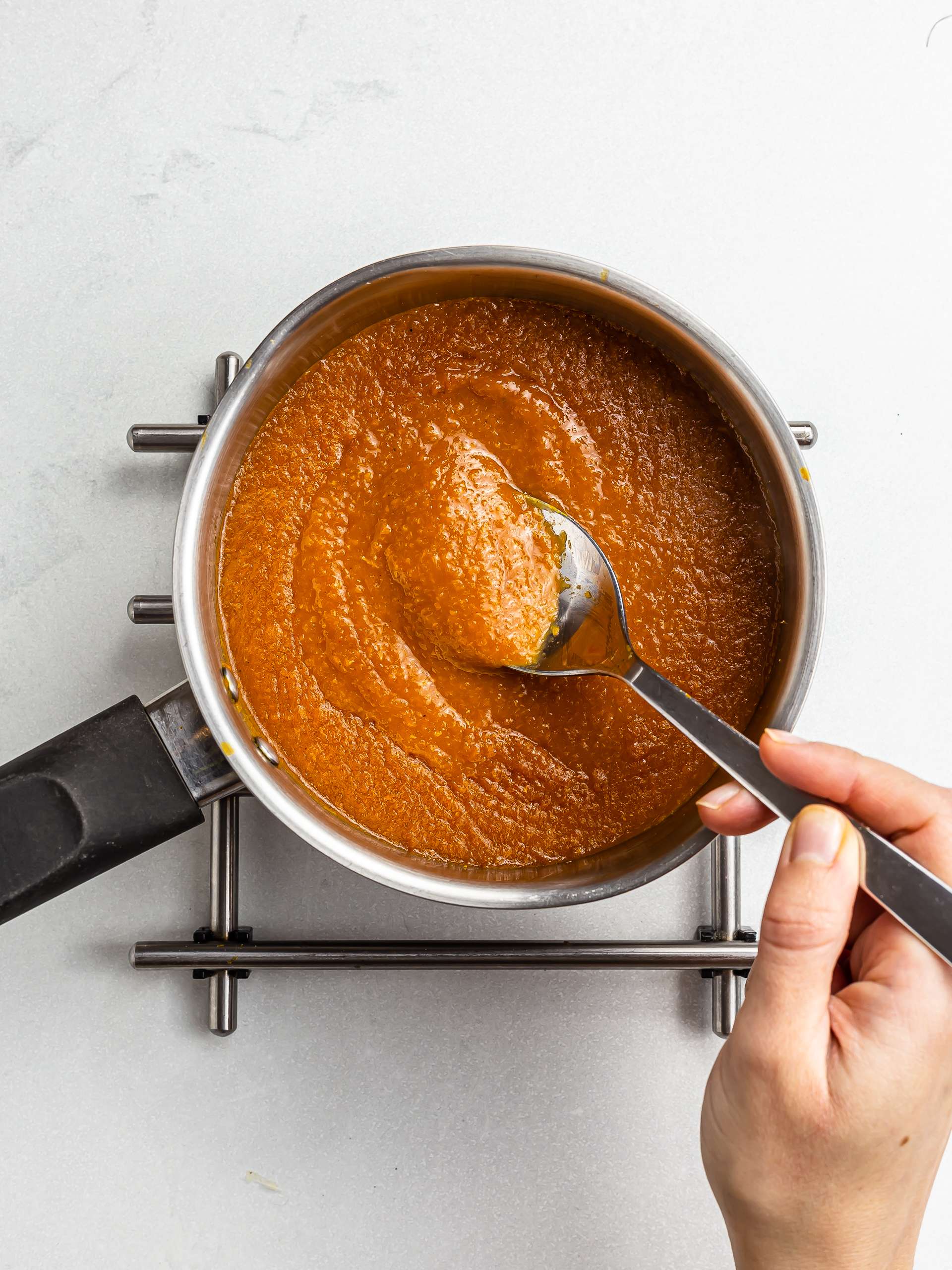 cooking apricot bbq sauce in a pot