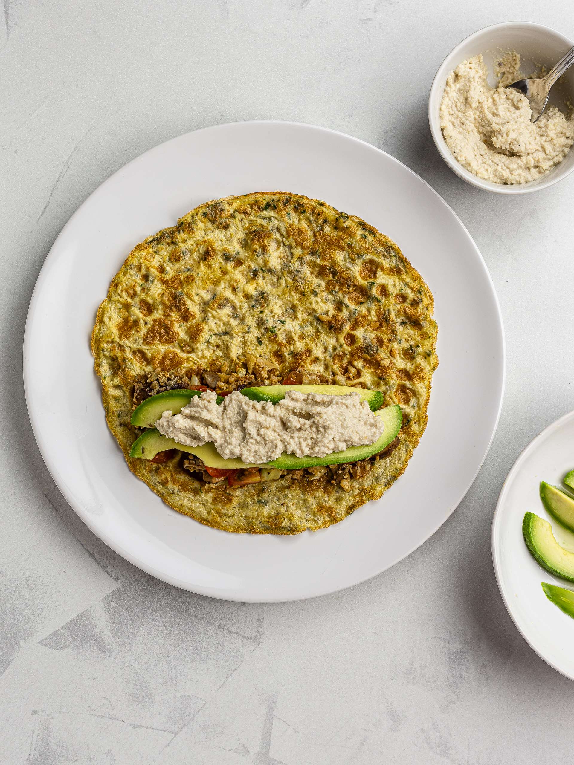low-carb burrito with egg tortilla and avocado