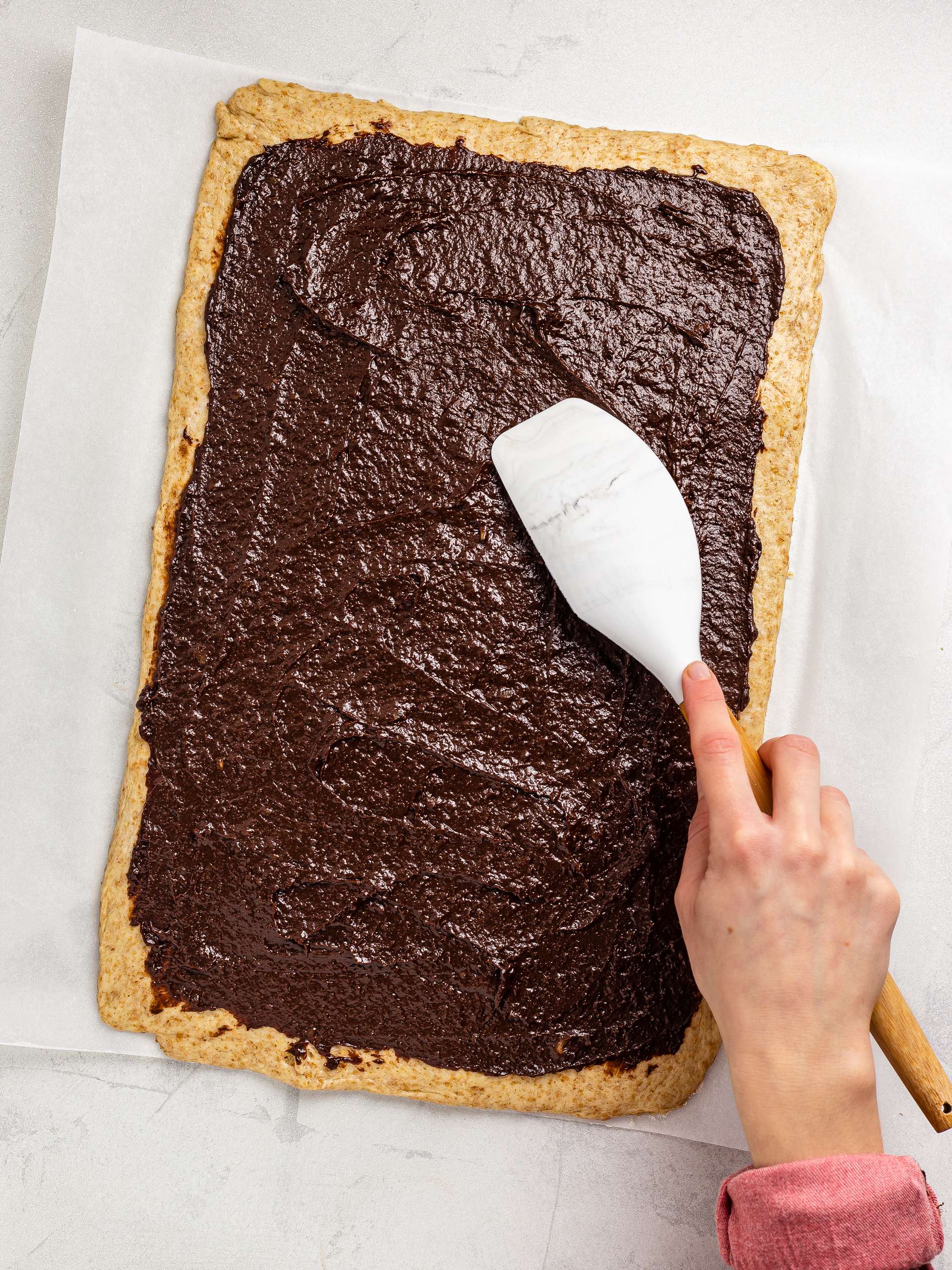 chocolate date filling spread over the dough base
