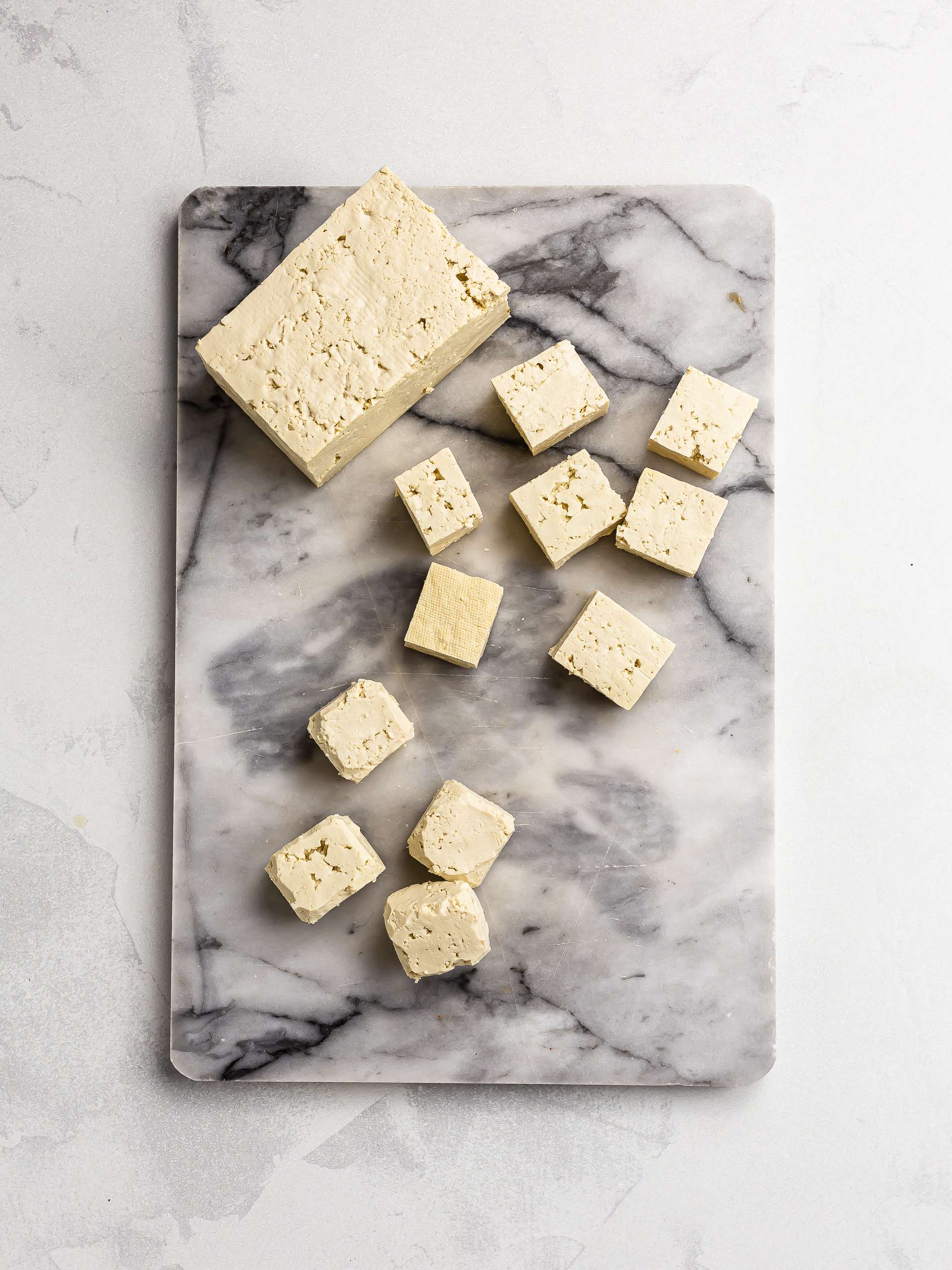 diced tofu on a chopping board