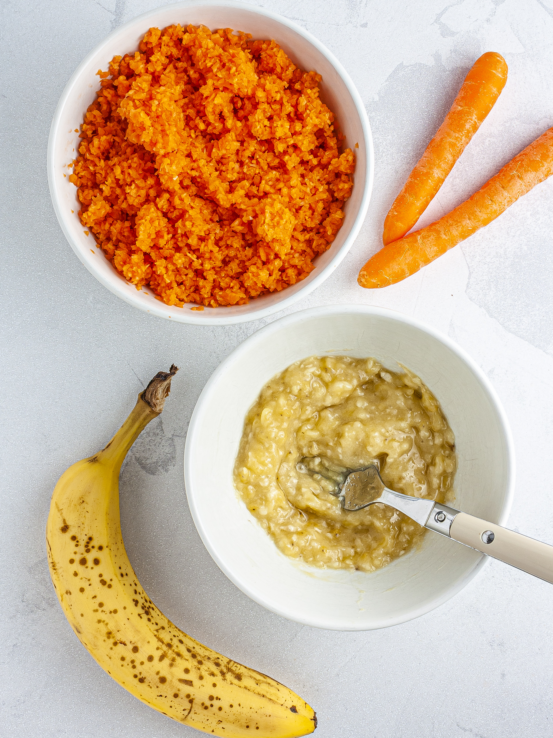 Grated carrots and mashed bananas.