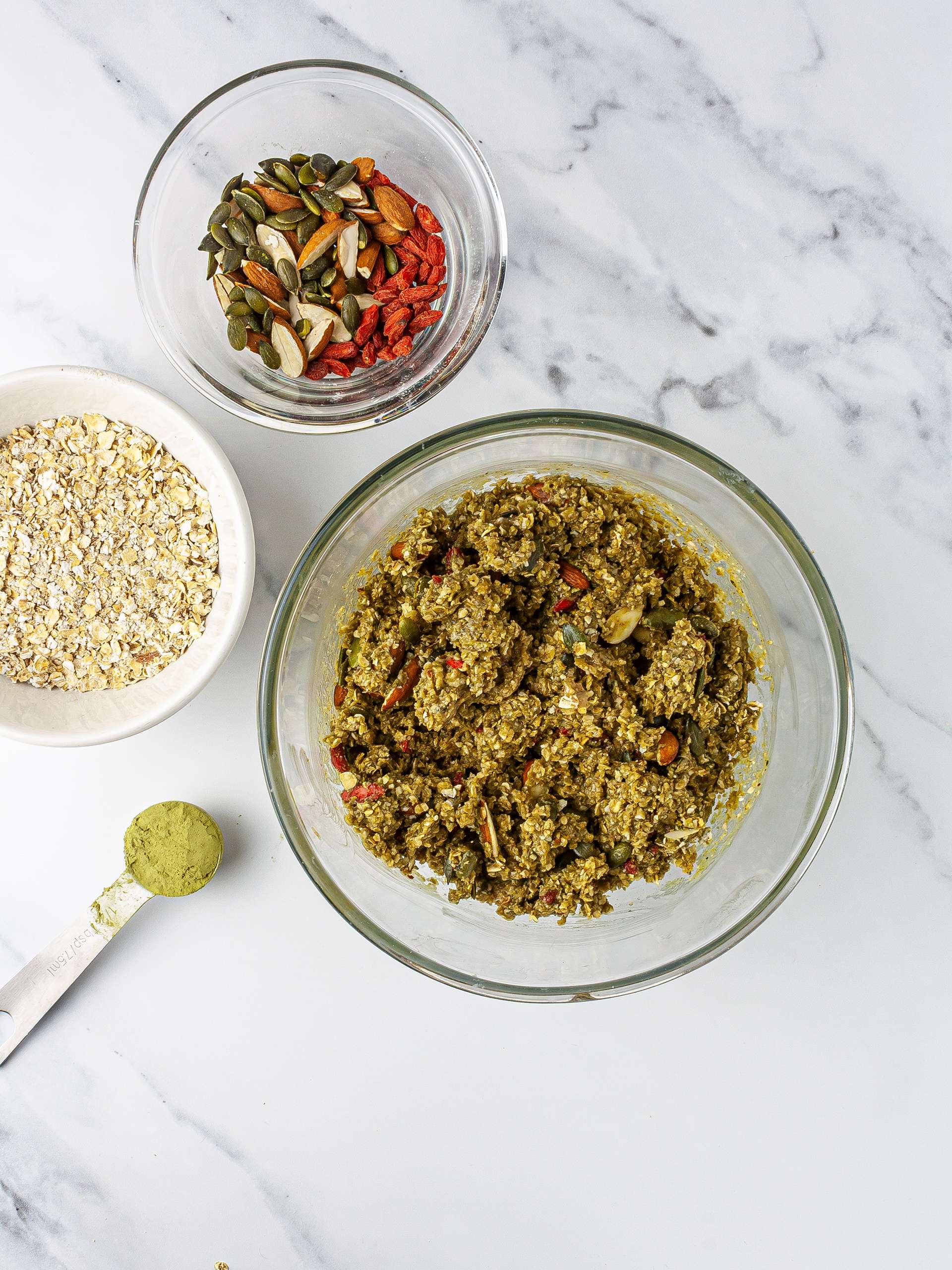 Granola ingredients mixed in a bowl.