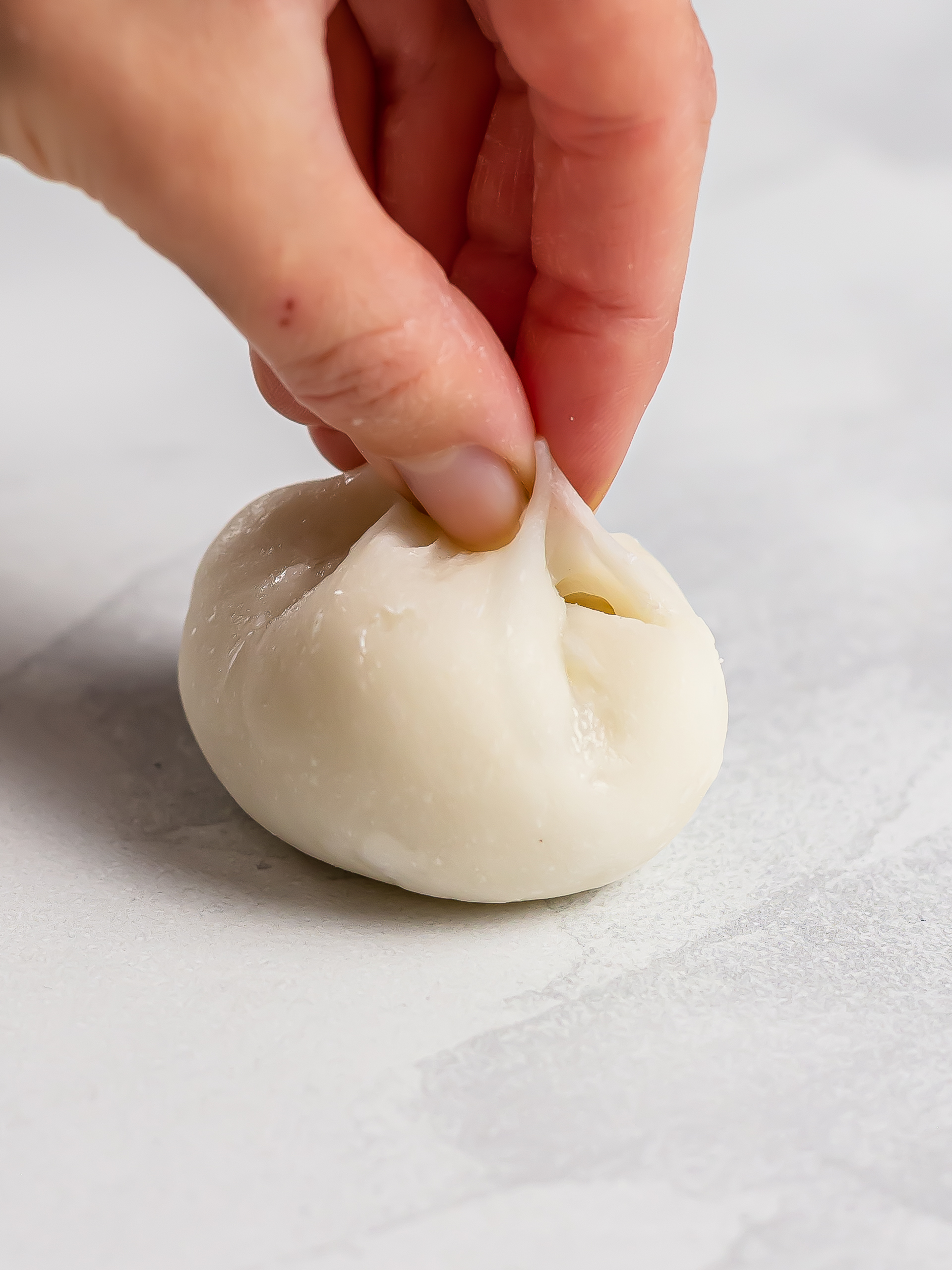 mochi dough folded over mango filling