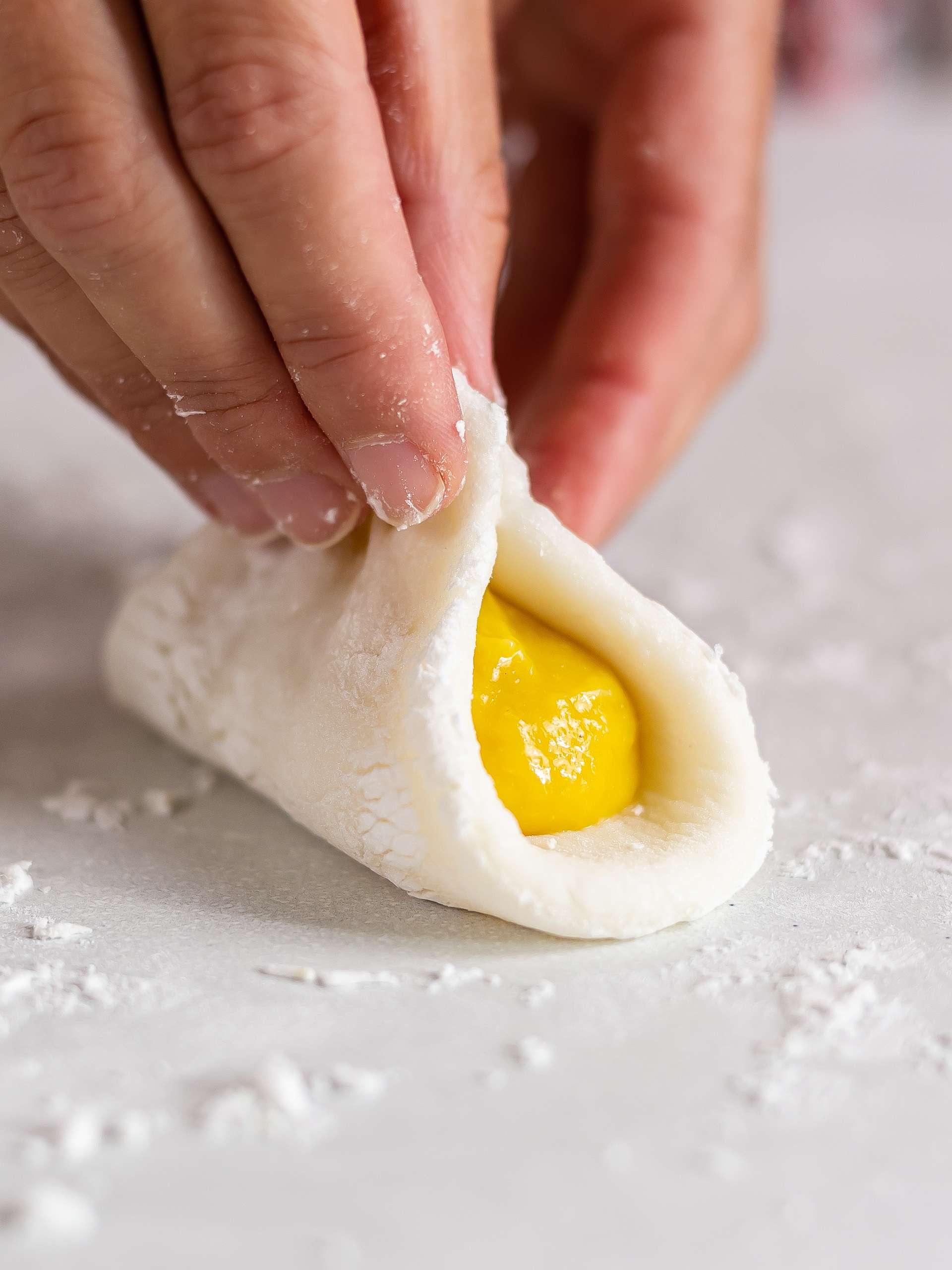 fold mochi dough over the mango filling
