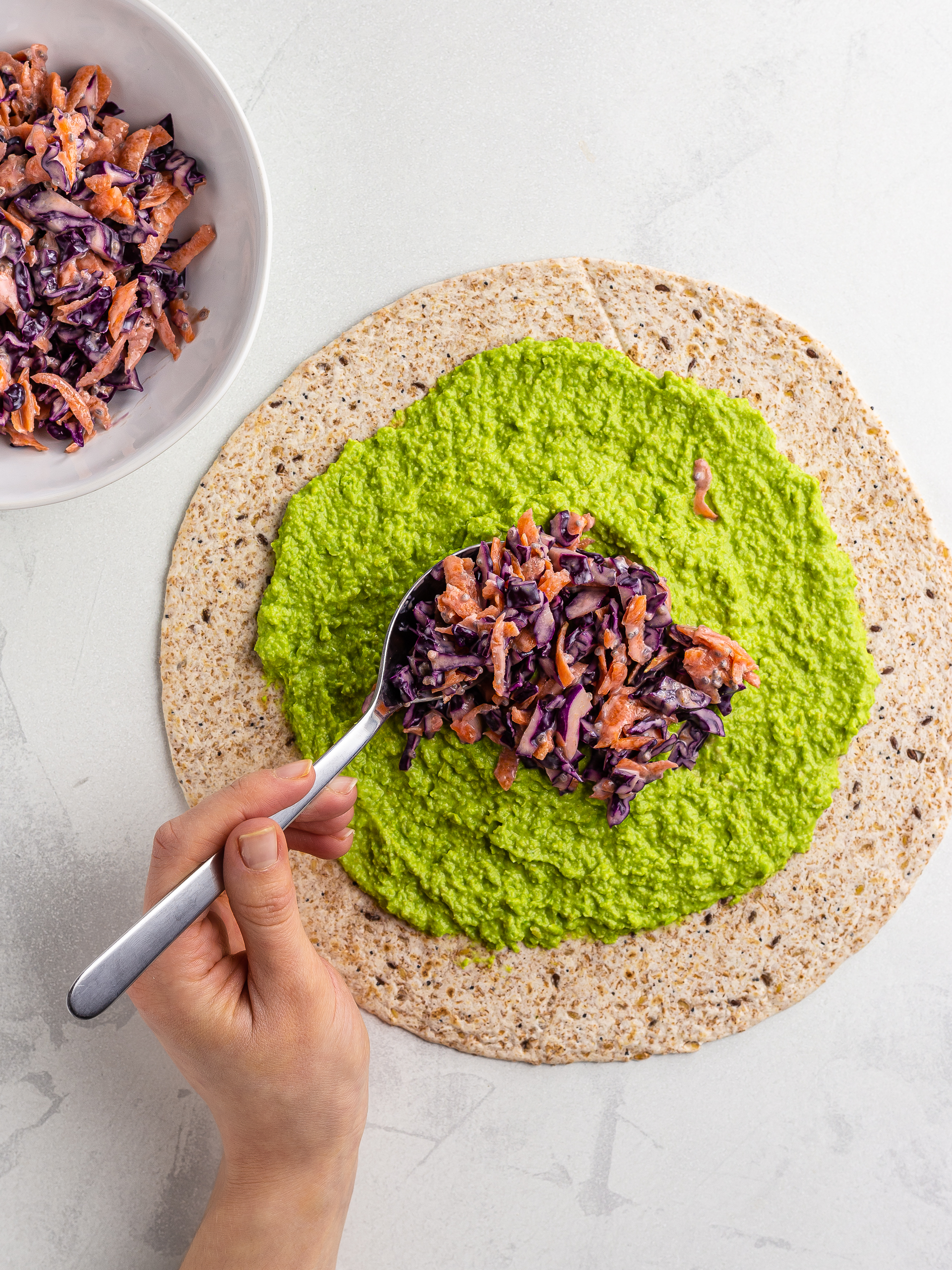 chia coleslaw on hummus wrap