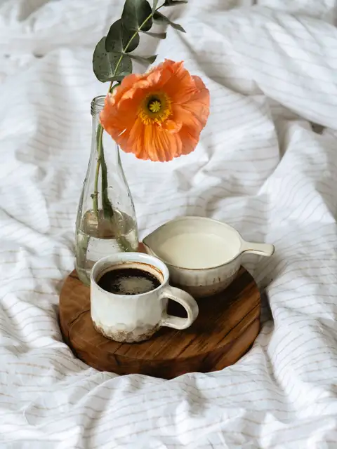 Breakfast served in bed on a sunny day