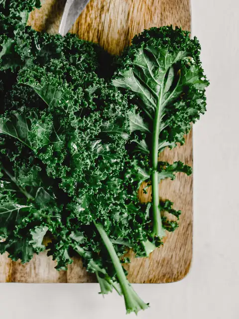 kale stalks on a chopping board