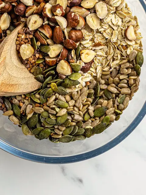 mix of oats nuts and seeds in a bowl